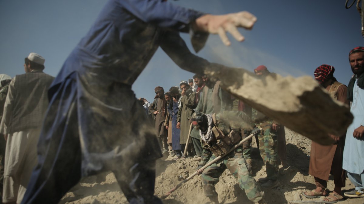 Taliban security officials and local residents inspect the scene of reported Pakistani airstrikes near the Pak-Afghan border in Nangarhar, Afghanistan, Feb. 22, 2026. (EPA Photo)