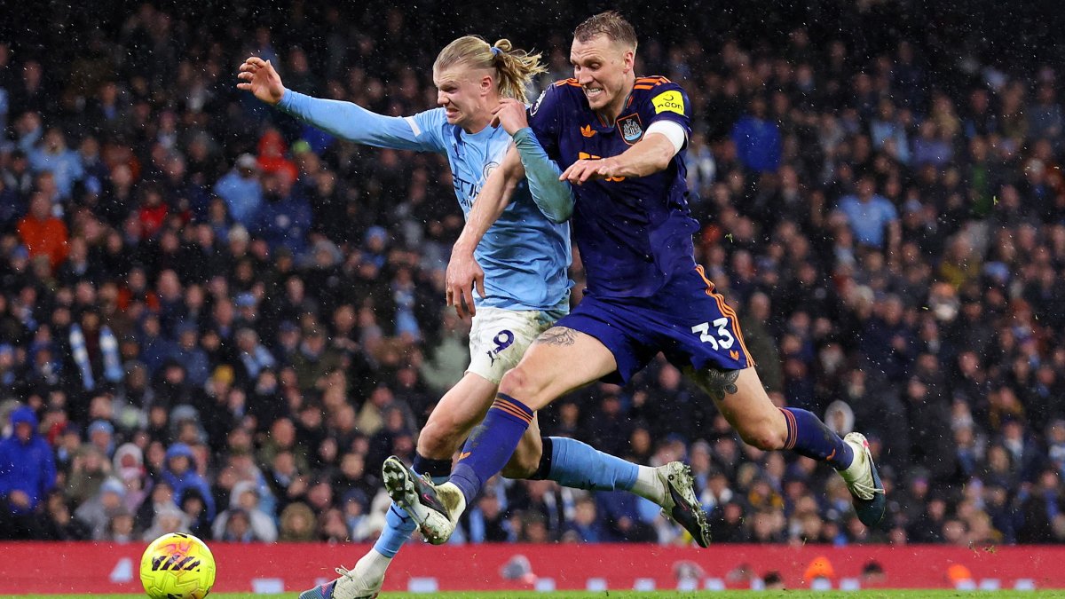 Manchester City's Erling Haaland in action with Newcastle United's Dan Burn during a Premier League match in Manchester, U.K., Feb. 21, 2026. (Reuters Photo)