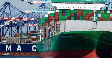 Shipping cranes stand above container ships loaded with shipping containers at the Port of Los Angeles in Los Angeles, California, U.S., Feb. 20, 2026. (AFP Photo)