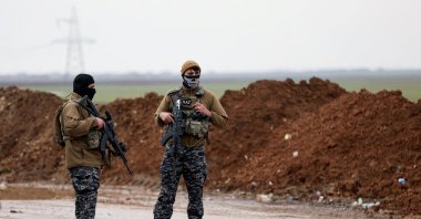 YPG terrorists seen on a road, Tel Hamis, Syria, Feb. 13, 2026. (Reuters Photo)