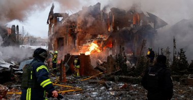 Firefighters work at the site of a residential building damaged during Russian drone and missile strikes, amid Russia's attack on Ukraine, in Kyiv, Ukraine, Feb. 22, 2026. (Reuters Photo)
