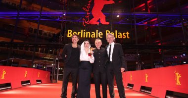 (From L-R) Ilker Çatak, Özgü Namal, Tansu Bicer and Ingo Fliess pose with the Golden Bear for Best Film for “Gelbe Briefe (Yellow Letters)” on the red carpet after the Award Ceremony of the 76th Berlinale International Film Festival Berlin at Berlinale Palast, Berlin, Germany, Feb. 21, 2026. (Getty Images Photo)