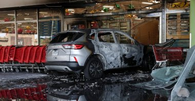 A burnt vehicle that was used during an attack on a supermarket by members of organized crime following a military operation in which Mexican officials said cartel boss Nemesio Oseguera, "El Mencho," was killed, Guadalajara, Mexico, Feb. 22, 2026. (Reuters Photo)