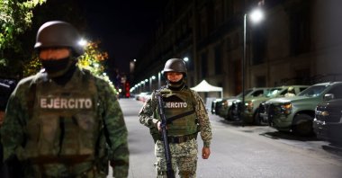 Members of the army patrol the perimeter of Palacio Nacional, where President Claudia Sheinbaum will hold her daily morning press conference about the wave of violence in Mexico, in Mexico City, Mexico, Feb. 23, 2026. (Reuters Photo)