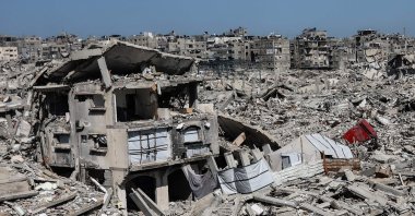 Tents housing displaced Palestinian families are erected between the rubble of homes and businesses destroyed by the Israeli military, in the Sheikh Radwan neighborhood of Gaza City, the Gaza Strip, Feb. 20, 2026. (AFP Photo)