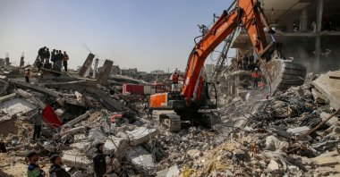 Palestinian civil defense teams working to recover the remains of 67 members of the Abu Nasr family from beneath the rubble of their home after it was destroyed in an Israeli airstrike in Beit Lahia, north of Gaza City, Feb. 15, 2026. (EPA Photo)