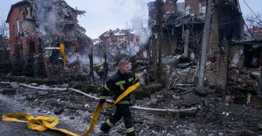 A firefighter is seen working at the site of a Russian missile attack in Kyiv, Ukraine, Feb. 22, 2026. (AA Photo)