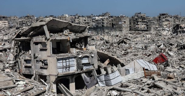 Tents housing displaced Palestinian families are erected between the rubble of homes and businesses destroyed by the Israeli military, in the Sheikh Radwan neighborhood of Gaza City, the Gaza Strip, Feb. 20, 2026. (AFP Photo)