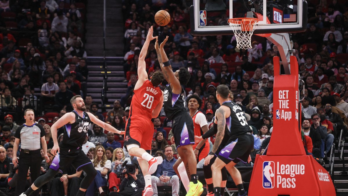 Houston Rockets center Alperen Şengün (2nd L) scores against Utah Jazz forward Brice Sensabaugh during the second quarter at Toyota Center in Houston, Texas, U.S., Feb. 23, 2026. (AFP Photo)