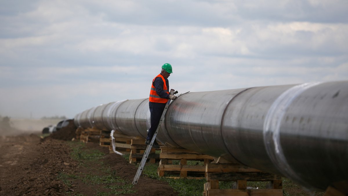 A worker is seen next to a pipe at a construction site on the extension of Russia's TurkStream gas pipeline, in Letnitsa, Bulgaria, June 1, 2020. (Reuters File Photo)