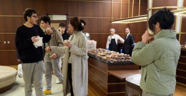 Students enjoy sahur while studying late at the Presidential National Library during Ramadan, Ankara, Türkiye, Feb. 24, 2026. (AA Photo) 