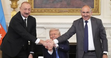 President Donald Trump shakes hands with Azerbaijan President Ilham Aliyev (L) and Armenian Prime Minister Nikol Pashinyan during a trilateral signing ceremony in the White House, Washington, U.S., Aug. 8, 2025. (AP Photo)