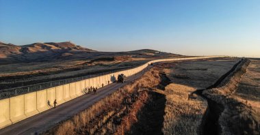 An aerial view shows the border wall between Türkiye and Iran as Turkish soldiers patrol, Van, eastern Türkiye, Nov. 1, 2024. (AFP Photo)