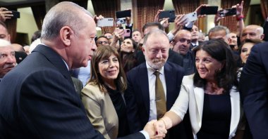 President Recep Tayyip Erdoğan is seen shaking hands with DEM Party lawmaker Pervin Buldan at a reception at Parliament, Ankara, Türkiye, Oct.1, 2025 (AA Photo)