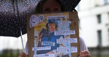 Protesters hold placards during a demonstration held by the London Freelance branch of the National Union of Journalists to honor journalists killed in Gaza, opposite Downing Street in London, U.K., Aug. 27, 2025. (AP Photo)