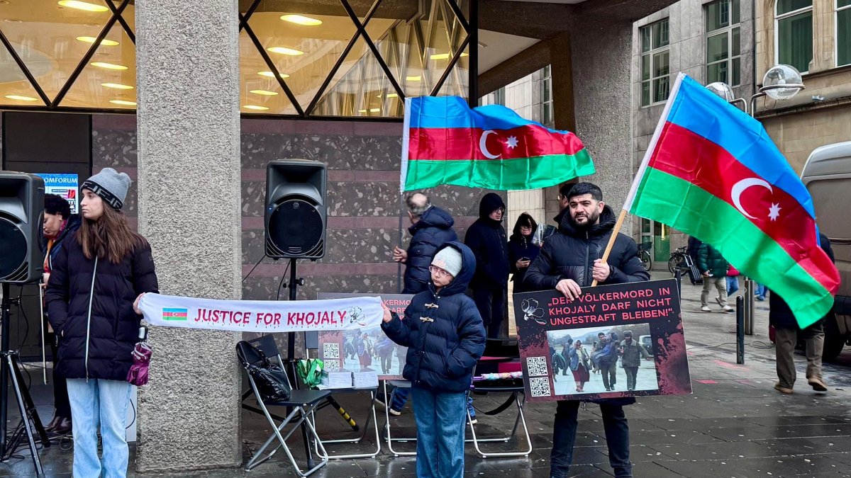 Azerbaijani citizens stage a rally to commemorate the Khojaly Massacre, Cologne, Germany, Feb. 24, 2026. (AA Photo)