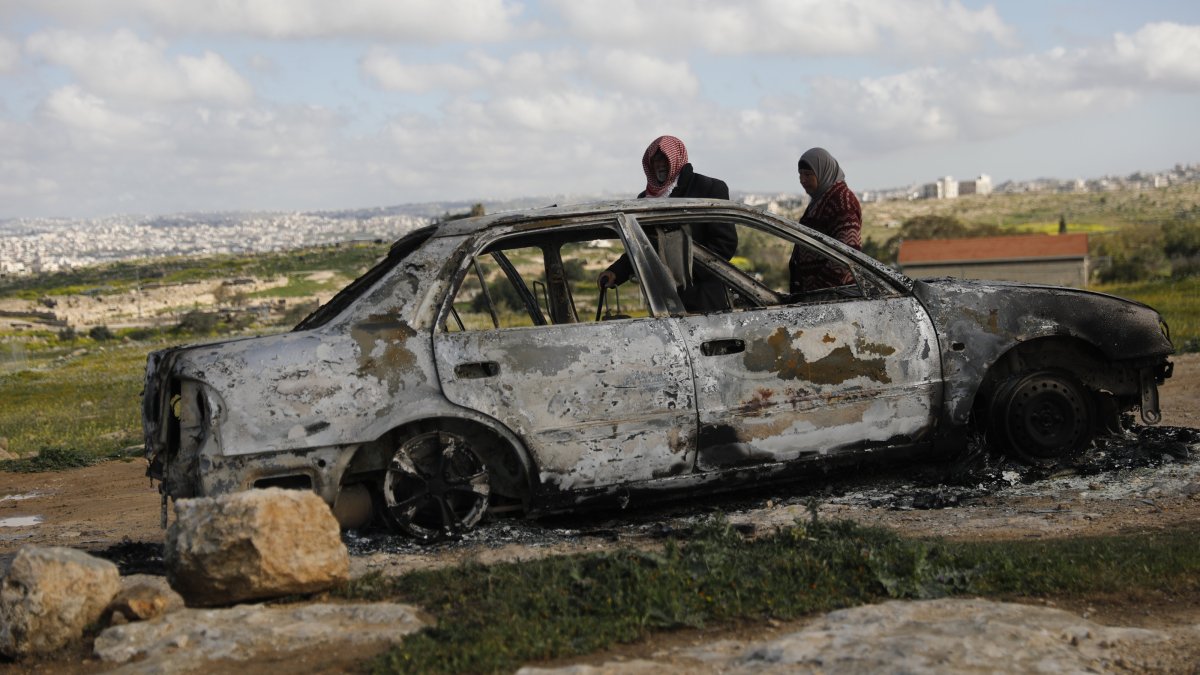 People inspect a site damaged in Israeli attacks in Hebron, the occupied West Bank, Feb. 25, 2026. (AA Photo)