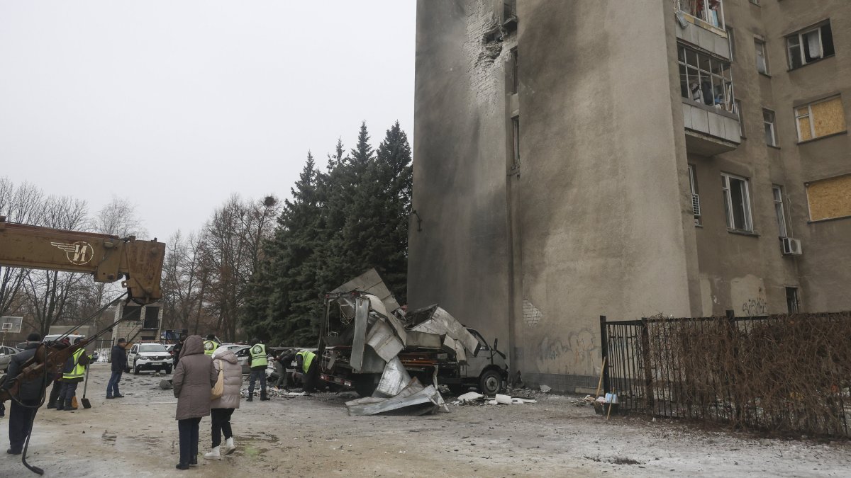 Ukrainian rescuers work at the site of a drone strike on a private building in Kharkiv, northeastern Ukraine, Feb. 26, 2026. (EPA Photo)