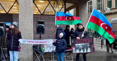 Azerbaijani citizens stage a rally to commemorate the Khojaly Massacre, Cologne, Germany, Feb. 24, 2026. (AA Photo)