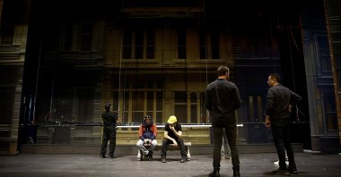 The “men in black,” SAMDOB’s technical crew, prepare the stage for "Singin’ in the Rain," Samsun, northern Türkiye, Feb. 23, 2026. (AA Photo)