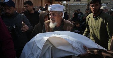 Mourners carry the body of a Palestinian who was killed when an Israeli strike hit tents sheltering displaced people along the coast of Khan Younis, according to hospital officials, at Nasser Hospital, Khan Younis, Gaza Strip, Palestine, Feb. 2, 2026. (AP Photo)