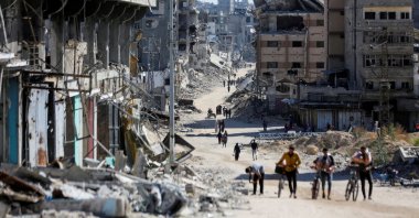 Palestinians make their way in a devastated neighborhood, amid the ongoing Israel-Hamas conflict, Gaza City, Palestine, Oct. 24, 2024. (Reuters Photo)
