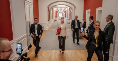 Prime Minister Mette Frederiksen walks with her special advisor in the Prime Minister's Office towards the Parliament Hall at Christiansborg in Copenhagen, Denmark Feb. 26, 2026. (Reuters Photo)
