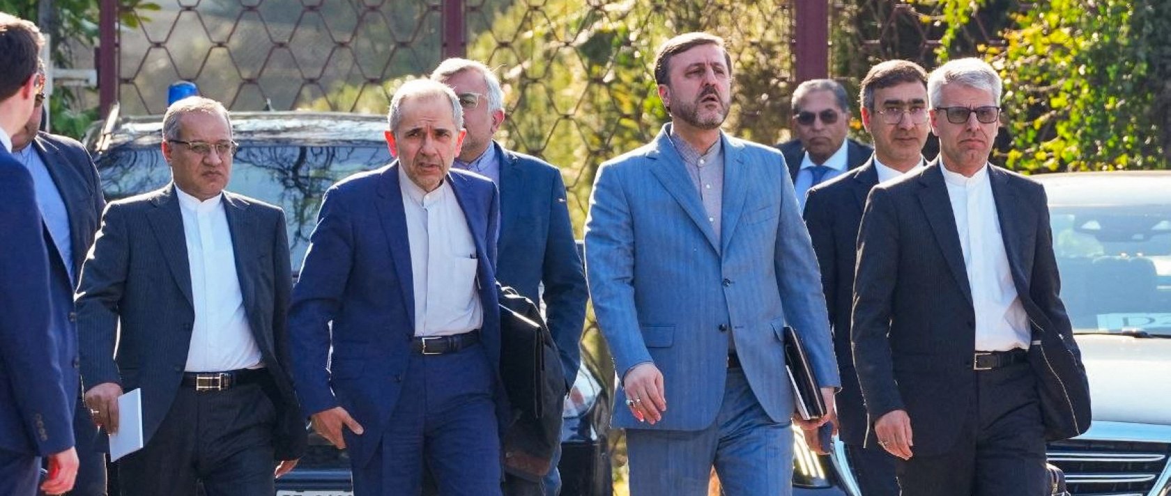 Iranian diplomats and delegation walk ahead of the Iran-U.S. talks in Geneva, Switzerland, Feb.26, 2026. (Iranian Foreign Ministry Handout via AFP)