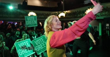Green Party winning candidate Hannah Spencer takes a selfie with supporters during an election after-event, Manchester, U.K., Feb. 27, 2026. (EPA Photo)