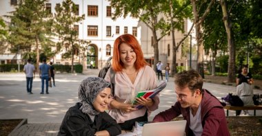 International students study and socialize together in the garden of a university campus, Ankara, Türkiye, July, 15, 2020. (Shutterstock Photo)