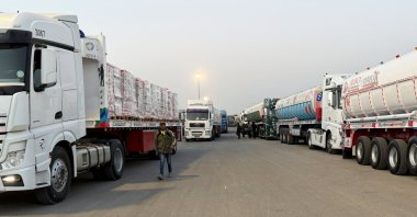 Trucks carrying humanitarian aid and fuel line up at the Rafah border to cross into the Gaza Strip, on the Egyptian side, in Rafah, Egypt, Feb. 8, 2026. (Reuters Photo)