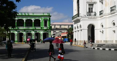 People walk through the city center, following an armed incident involving a Florida-registered speedboat and a Cuban patrol, in Santa Clara, Cuba, February 26, 2026. REUTERS/Norlys Perez