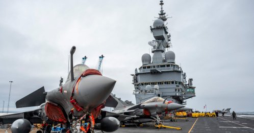 Rafale M (Marine) fighter jets parked on the flight deck with the conning tower in the background as the French aircraft carrier Charles De Gaulle during a media tour while moored at the quay of the North Port in Malmo, Sweden, Feb. 25, 2026. (AFP Photo)