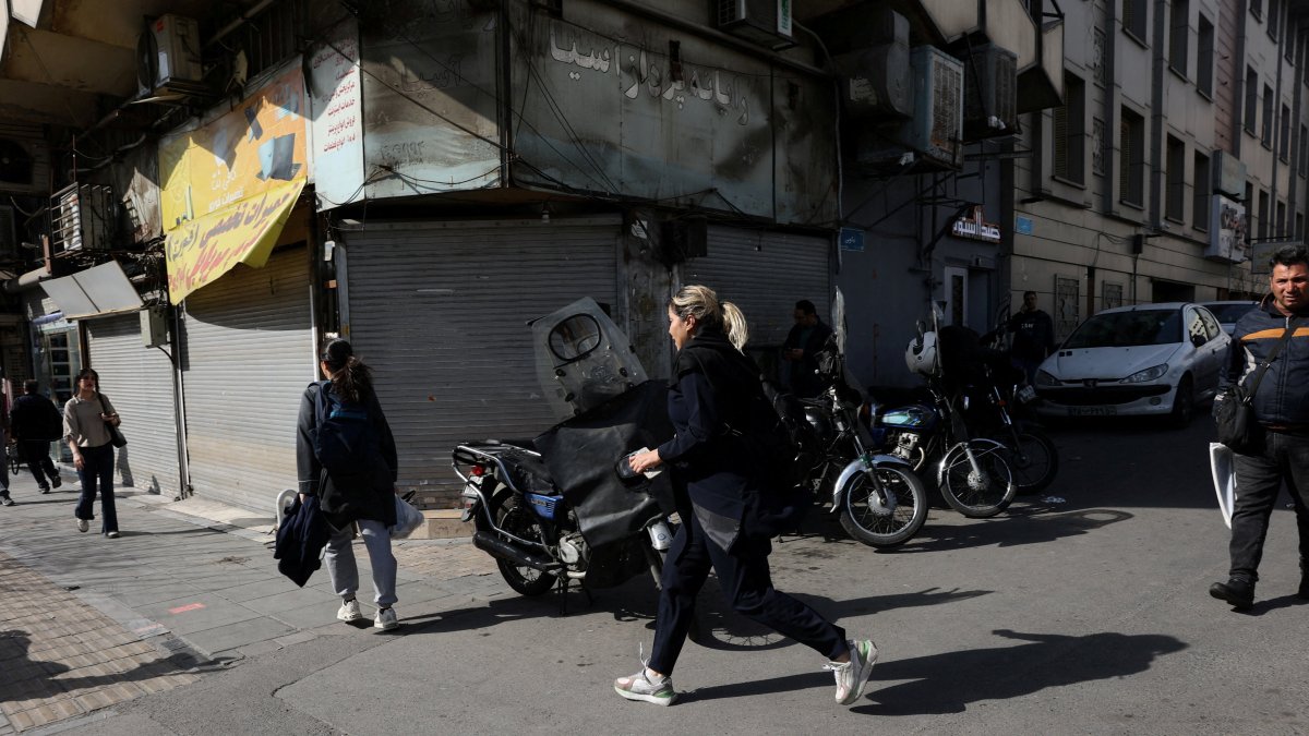 People run for cover following an explosion, after Israel said it launched a pre-emptive attack against Iran, in Tehran, Iran, Feb. 28, 2026. (Reuters Photo)