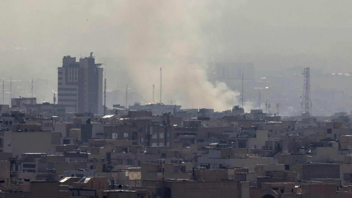 A plume of smoke rises following a reported Israeli strike in Tehran, Iran, Feb. 28, 2026. (AFP Photo)