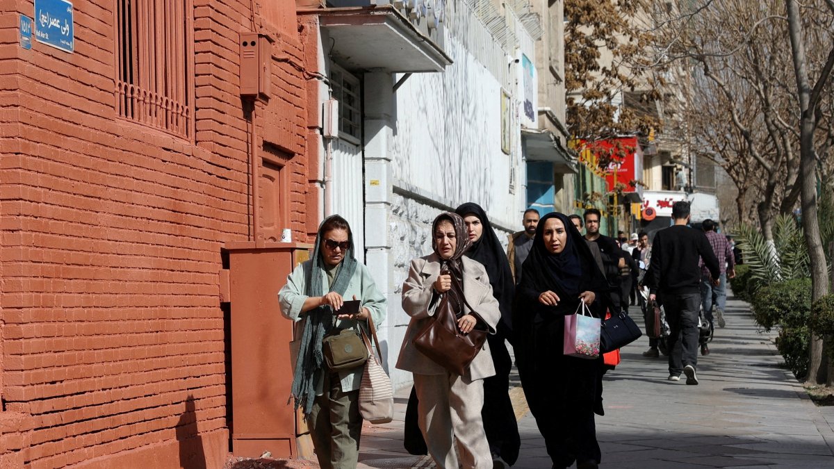 People run for cover following an explosion, after Israel said it launched a pre-emptive attack against Iran, in Tehran, Iran, Feb. 28, 2026. (Reuters Photo)