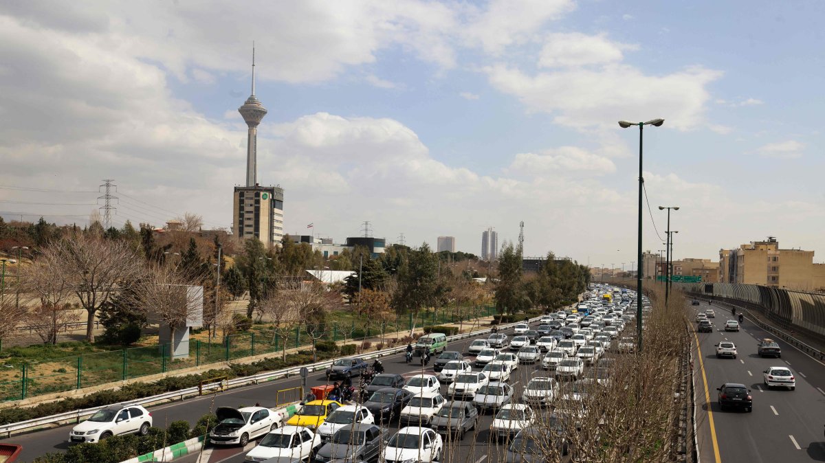 Motorists make their way along a street amid U.S., Israeli strikes, in Tehran, Iran, Feb. 28, 2026. (AFP Photo)