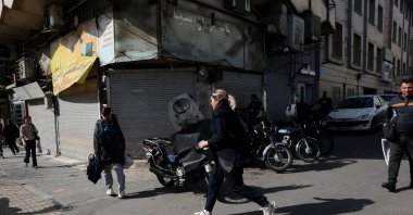 People run for cover following an explosion, after Israel said it launched a pre-emptive attack against Iran, in Tehran, Iran, Feb. 28, 2026. (Reuters Photo)