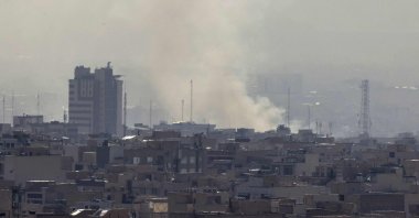 A plume of smoke rises following a reported Israeli strike in Tehran, Iran, Feb. 28, 2026. (AFP Photo)