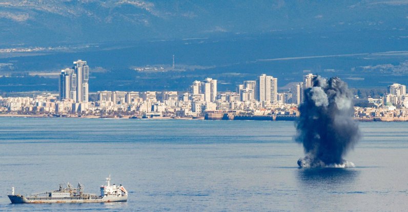 An incoming projectile explodes over the water in the bay of Haifa off of the northern coastal city, Israel, Feb. 28, 2026. (AFP Photo)