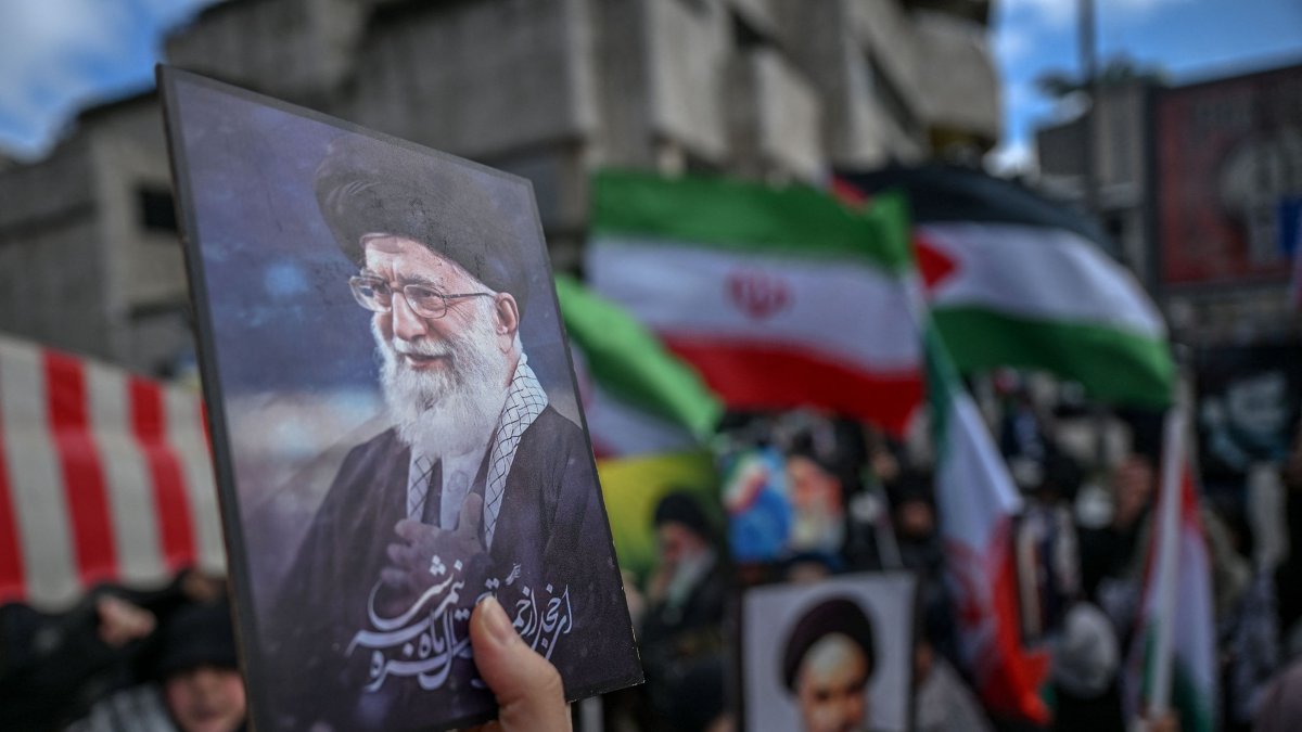 Protestors hold portraits of Iran's late supreme leader Ayatollah Ali Khamenei as they gather to protest against the U.S. and Israel attack of Iran and the killing of the Supreme leader in front of Israel Consulate in Istanbul, Türkiye, March 1, 2026. (AFP Photo)
