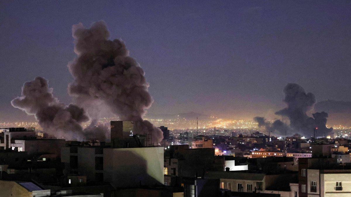 Smoke plumes rise following missile strikes in Tehran, Iran, March 1, 2026. (AFP Photo) 