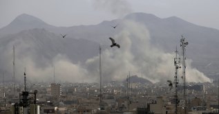 Plumes of smoke rise from multiple sites targeted by Israeli airstrikes on Tehran, Iran, March 1, 2026. (AA Photo)