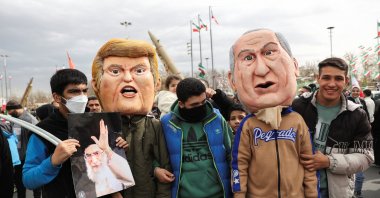 Attendees wear masks depicting U.S. President Donald Trump and Israeli Prime Minister Benjamin Netanyahu, during the 47th anniversary of the Islamic Revolution, Tehran, Iran, Feb. 11, 2026. (Reuters Photo)