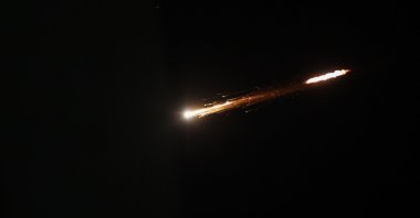 A picture shows an Iranian projectile trailing in the sky above the city of Ramallah, in the Israeli-occupied West Bank, Feb. 28, 2026. (AFP Photo)