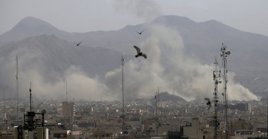Plumes of smoke rise from multiple sites targeted by Israeli airstrikes on Tehran, Iran, March 1, 2026. (AA Photo)