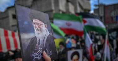 Protestors hold portraits of Iran's late supreme leader Ayatollah Ali Khamenei as they gather to protest against the U.S. and Israel attack of Iran and the killing of the Supreme leader in front of Israel Consulate in Istanbul, Türkiye, March 1, 2026. (AFP Photo)