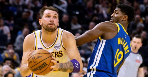 Lakers guard Luka Doncic (L) drives past Warriors guard Nate Williams during an NBA game in San Francisco, U.S., Feb. 28, 2026. (AP Photo)