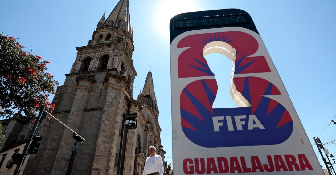 A man walks past a clock counting down the days for the 2026 FIFA World Cup next to the Cathedran in Guadalajara, Jalisco state, Mexico, Feb. 20, 2026. (AFP Photo)