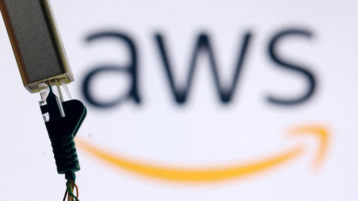 AN a AWS logo and broken ethernet cable are seen in this illustration, Oct. 20, 2025. (Reuters Photo)
